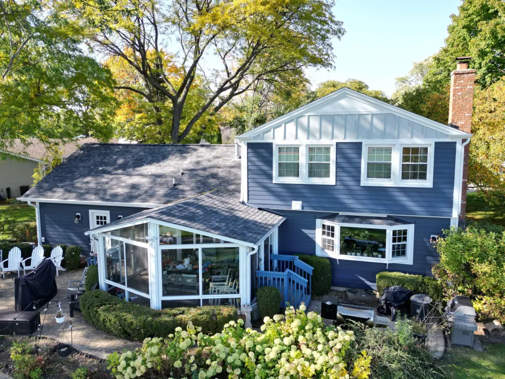 Deep Ocean siding with Arctic White trim and Light Mist board and batten accents