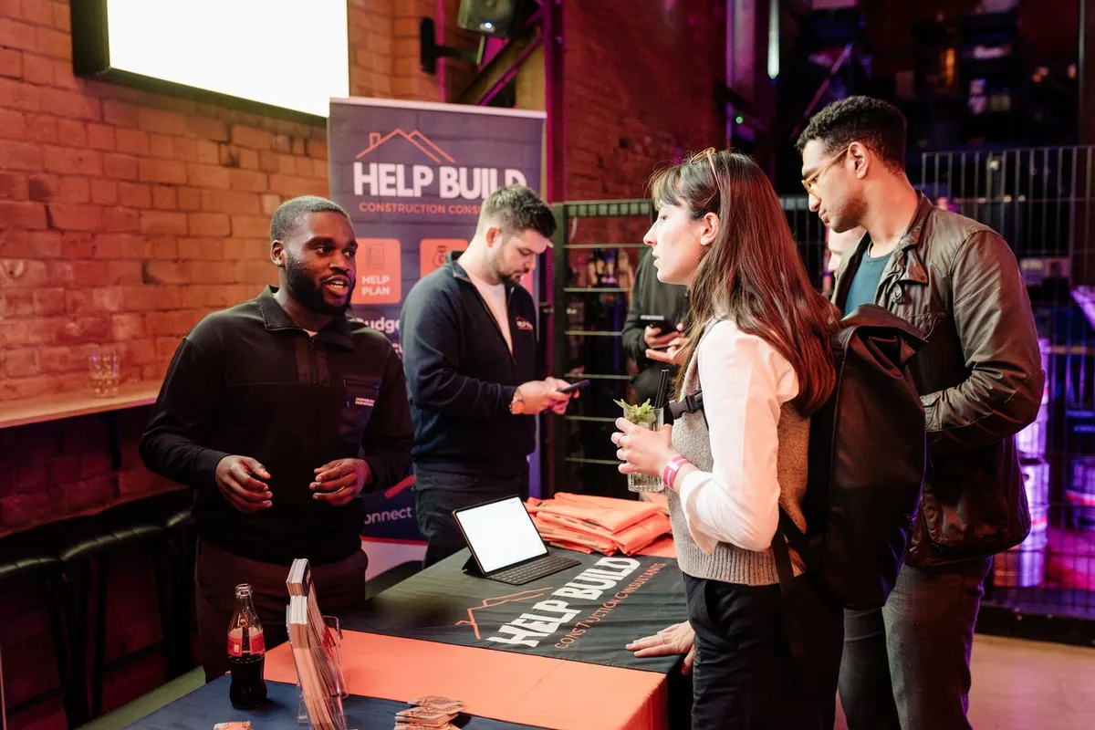 Guests at an exhibitor stand at UK Homes Network LIVE Birmingham