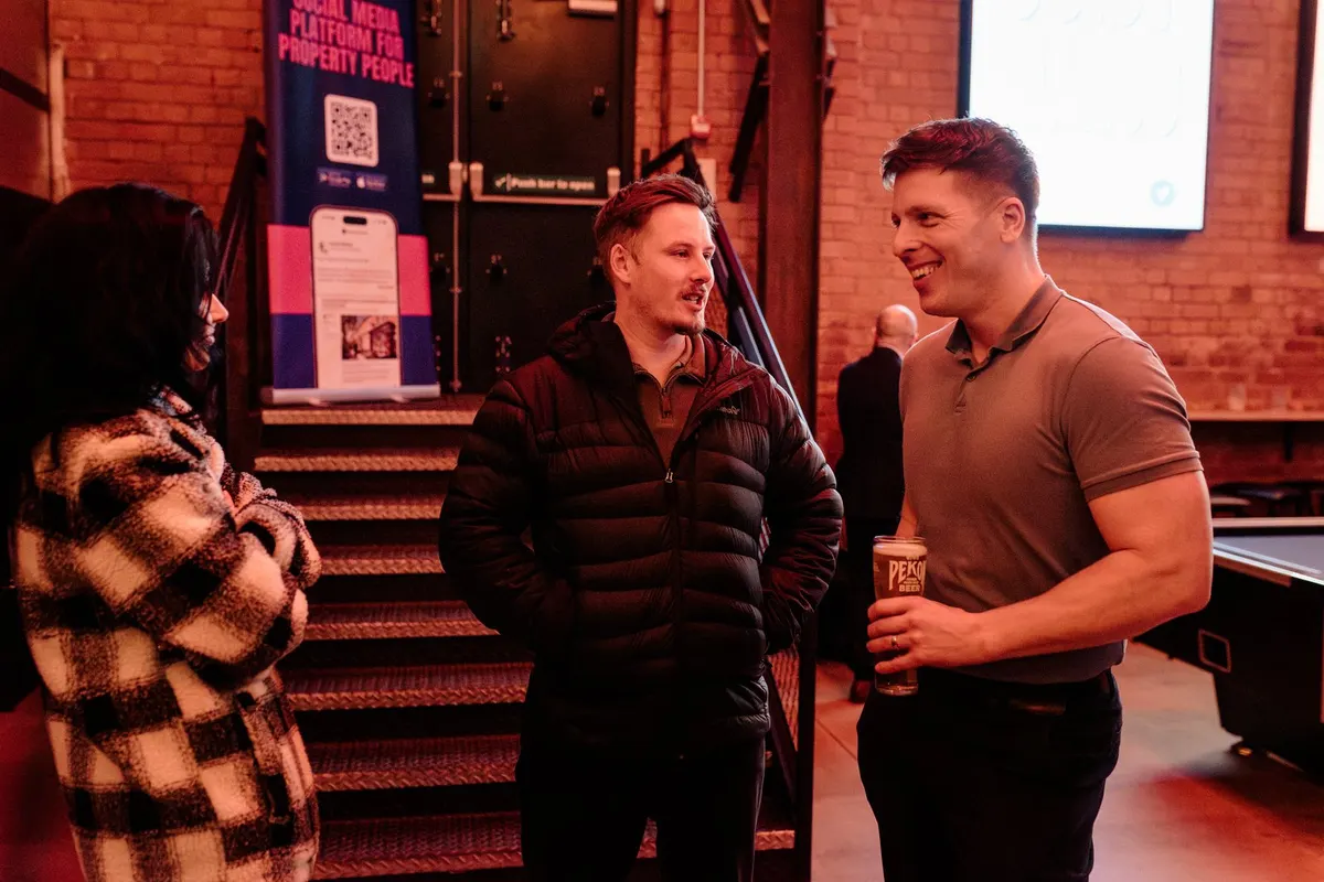 Guests chatting by the stairs at the Indian Brewery Taproom, Birmingham
