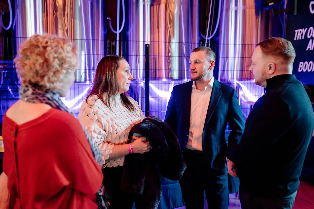 Guests talking under the brewery lights at UK Homes Network LIVE Birmingham, February 2026