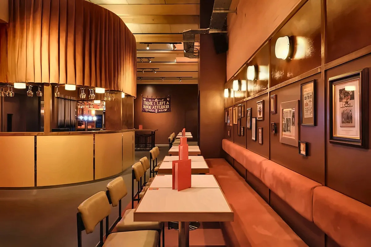 The bar and booths at Flukes, inside Big Penny Social, Walthamstow