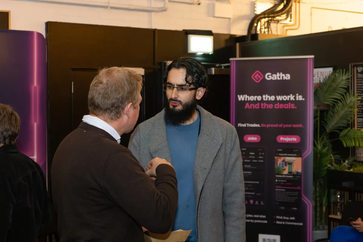 Guests in conversation by the Gatha banner at Archive, Leeds