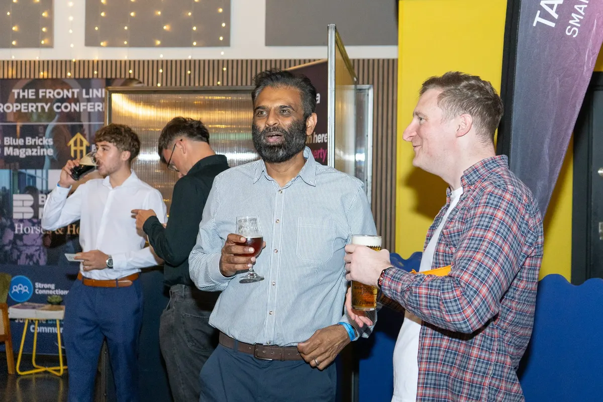 Four guests sharing a laugh over drinks at Archive, Leeds