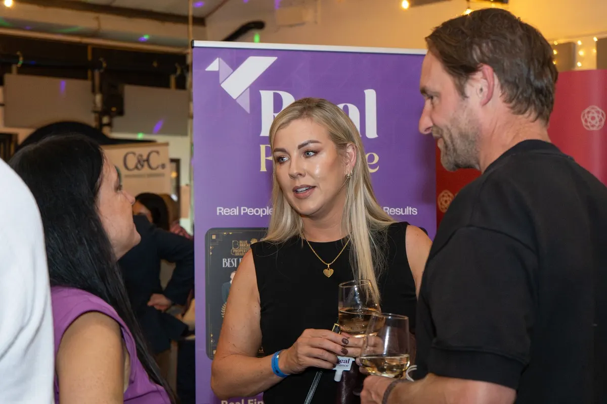 Guests with drinks at a UK Homes Network LIVE evening in Leeds