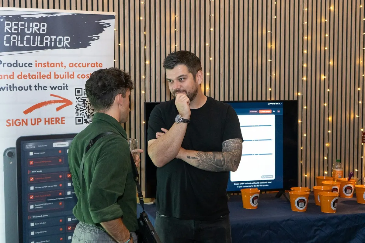 Two guests at an exhibitor stand at UK Homes Network LIVE Leeds