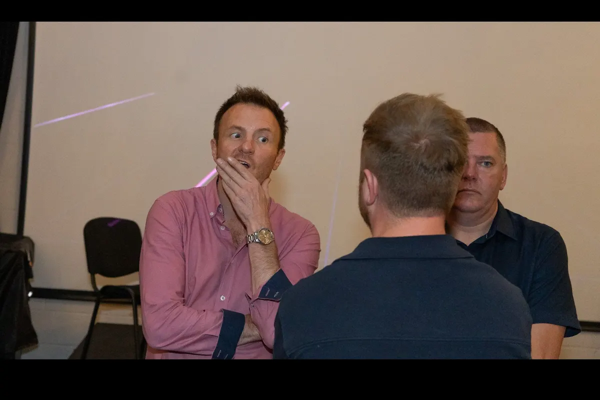 Three guests sharing a joke at UK Homes Network LIVE Leeds