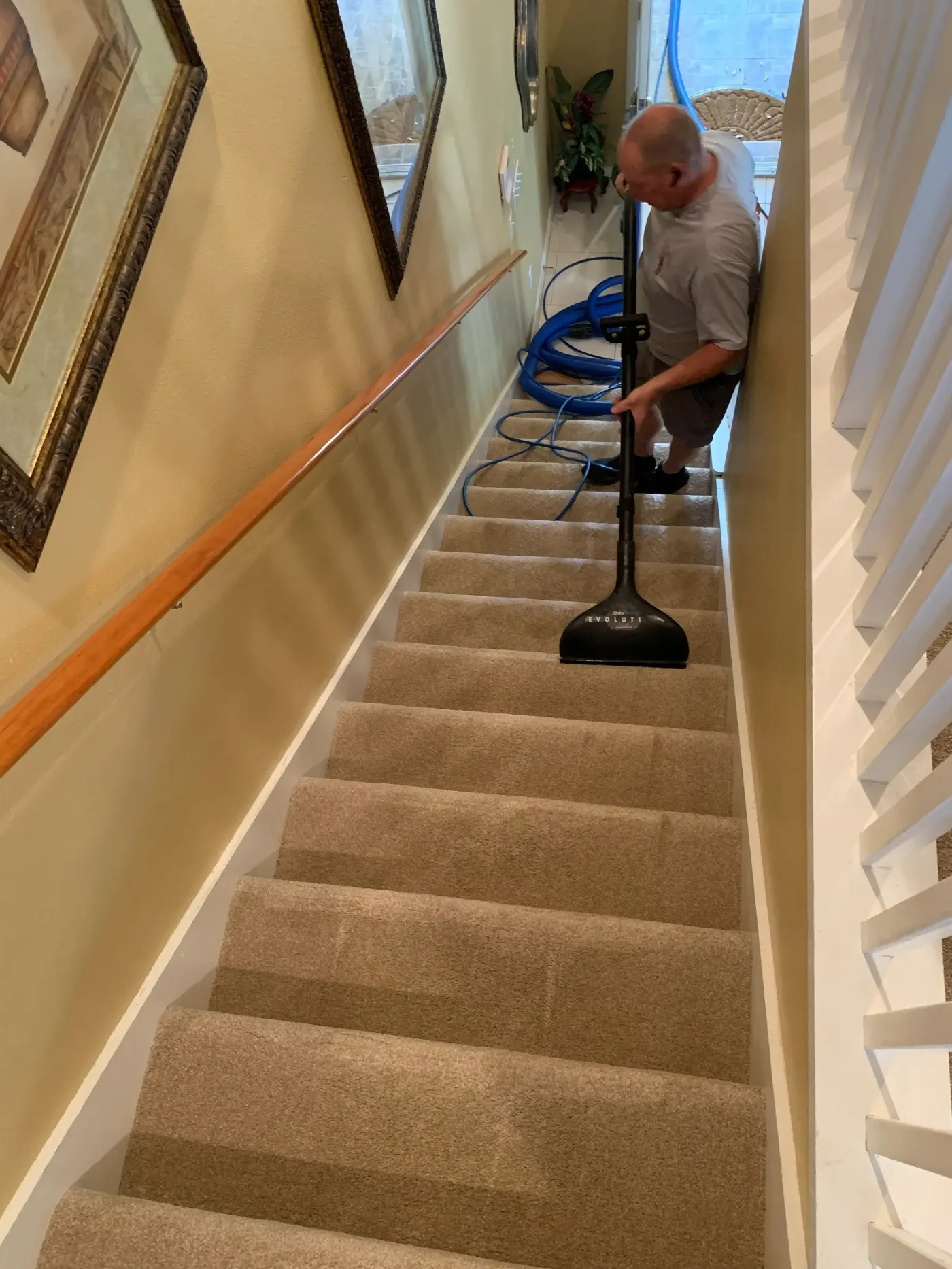 Sahara Carpet Care cleaning carpeted stairs in a home