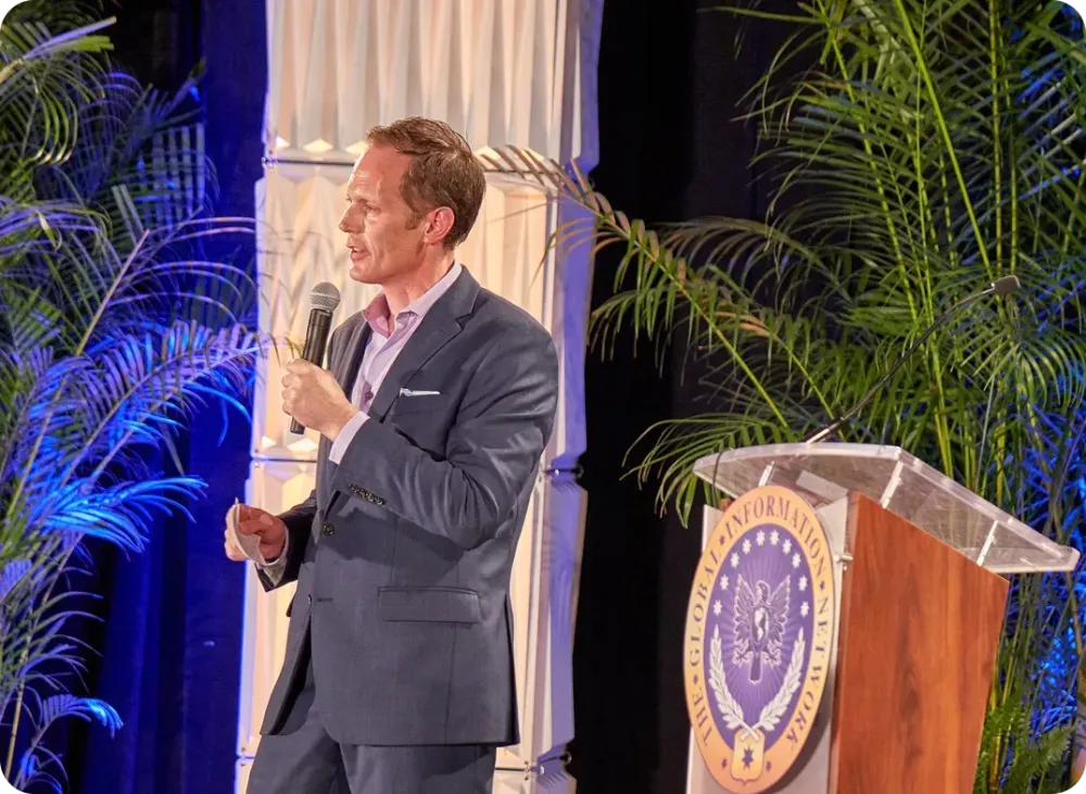 David Krueger speaking on stage