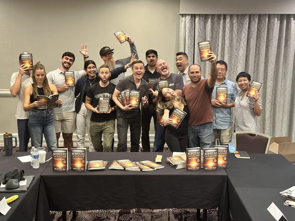 A group of readers each holding Authentic Self Rebirth