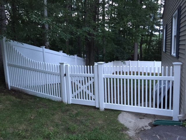 White vinyl picket fence and gate by All Fenced In