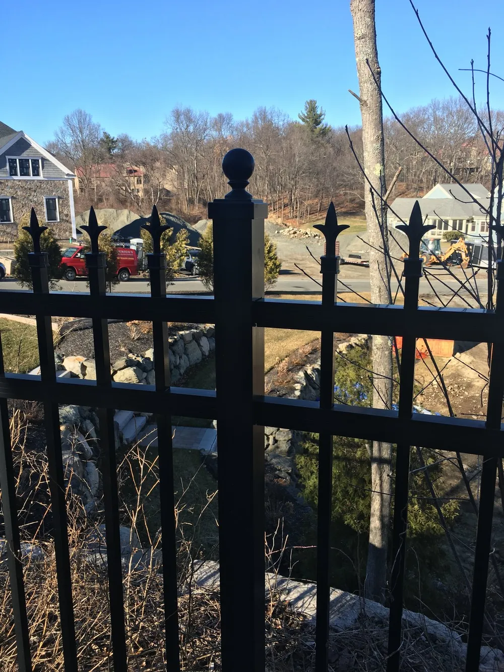 Black aluminum fence with spear-top posts by All Fenced In