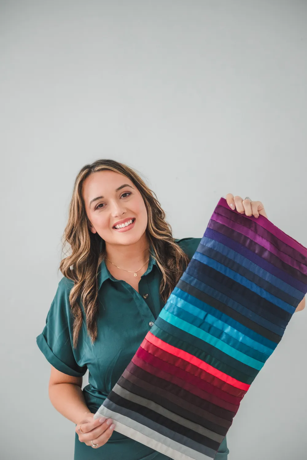 Bethany Brenneman holding a drape of color swatches