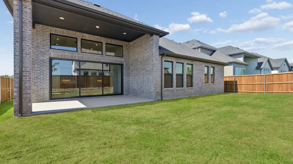 Covered patio and backyard of a new home