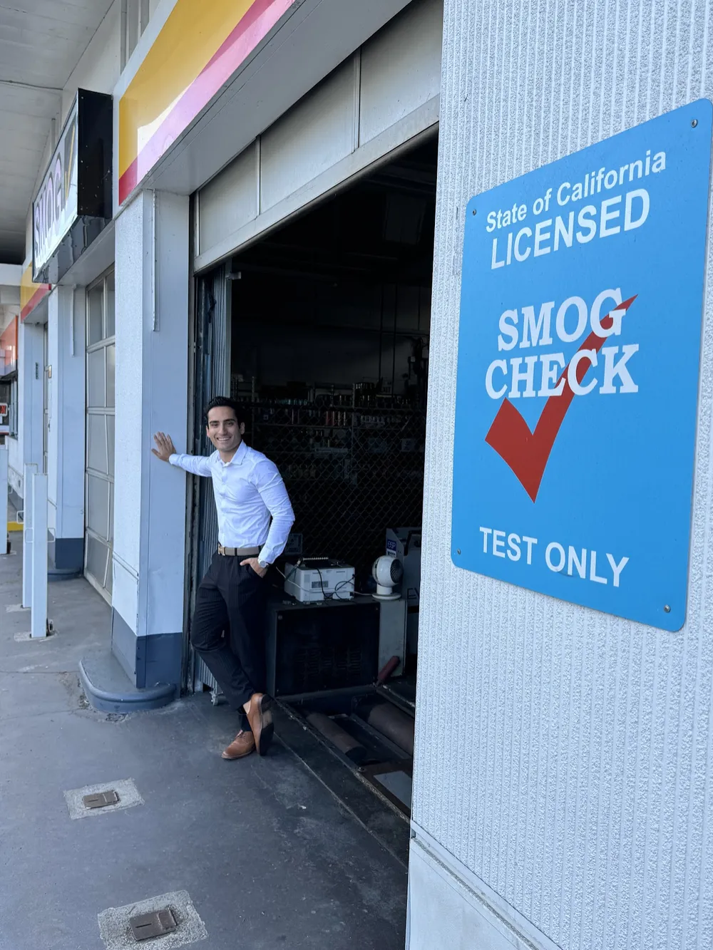 Arian Nazari outside a licensed smog check station