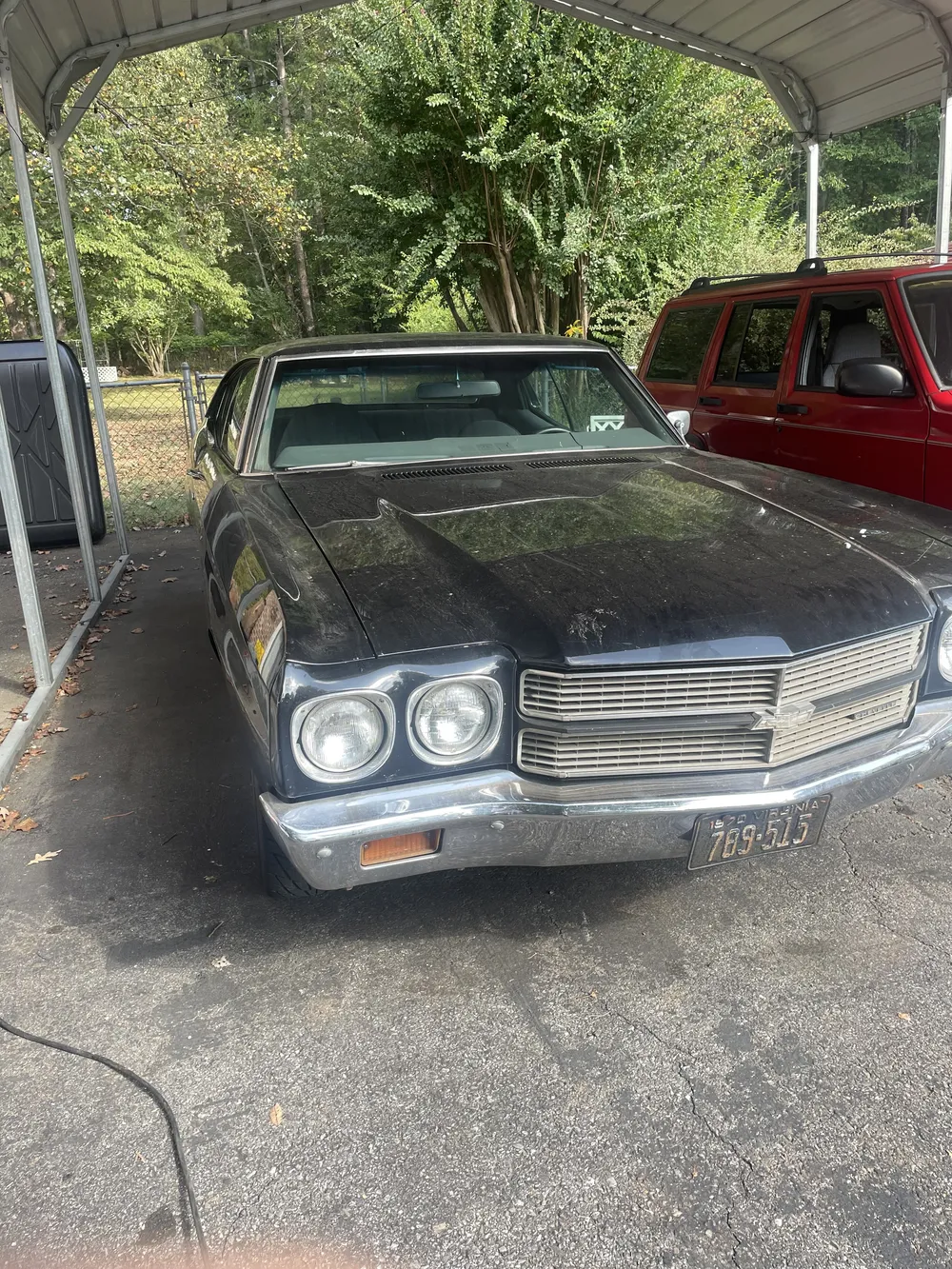 Black Chevy Chevelle before an exterior detail
