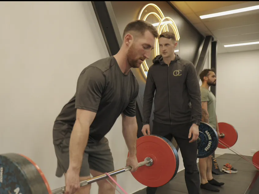 A personal trainer coaching an OC Health Clubs member in Queenstown
