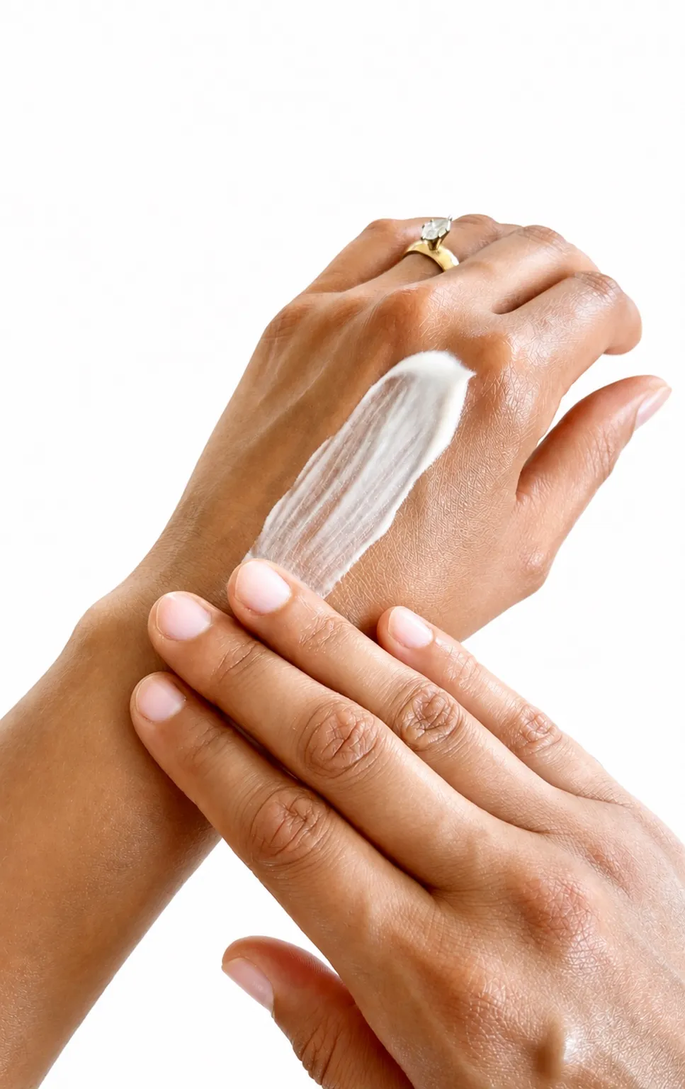 The balm being worked into the skin with the fingertips