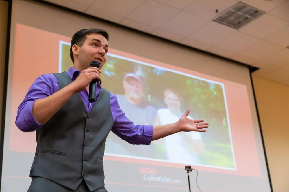 Jon Weberg speaking to a conference audience