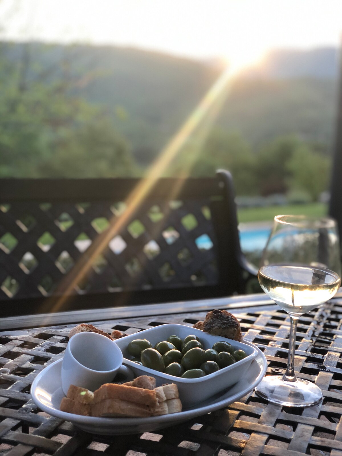 Outdoor table in the evening light at Villa Pregiata