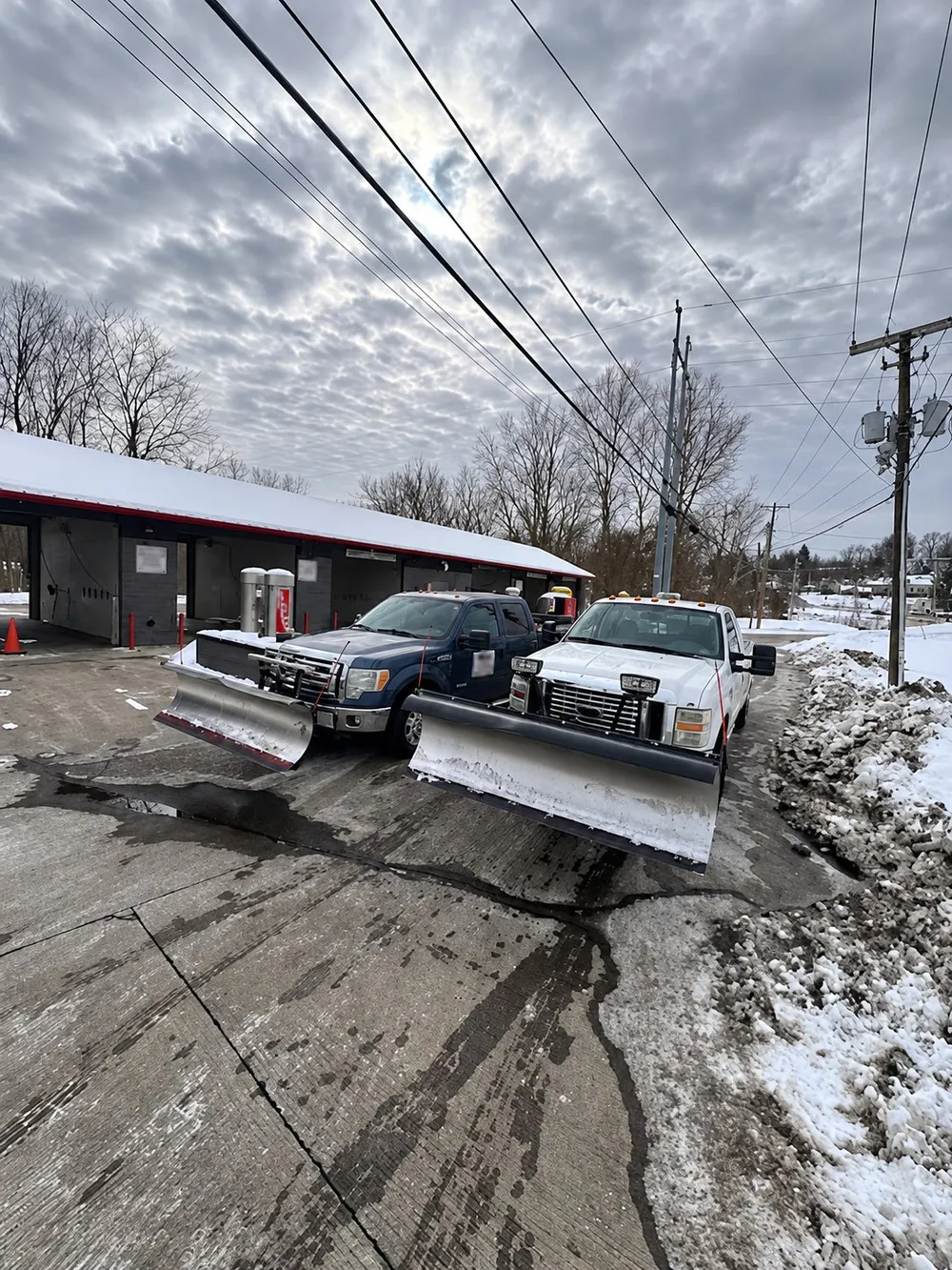 A2Z plow trucks with the blades mounted, ready for the storm