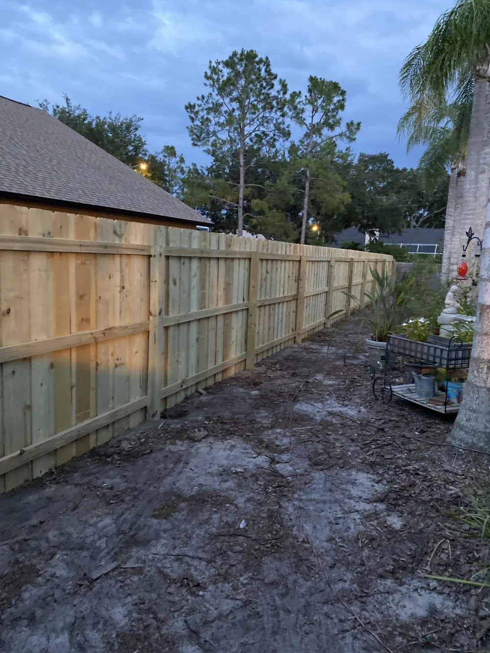Wood privacy fence at dusk