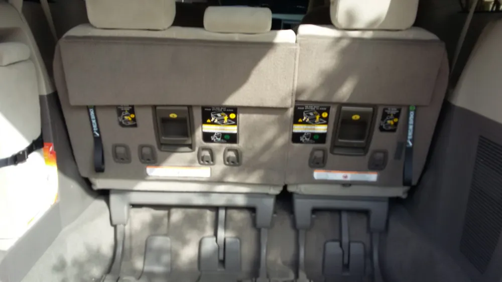 Clean, comfortable seating inside The Shuttle minivan for rides to entertainment venues