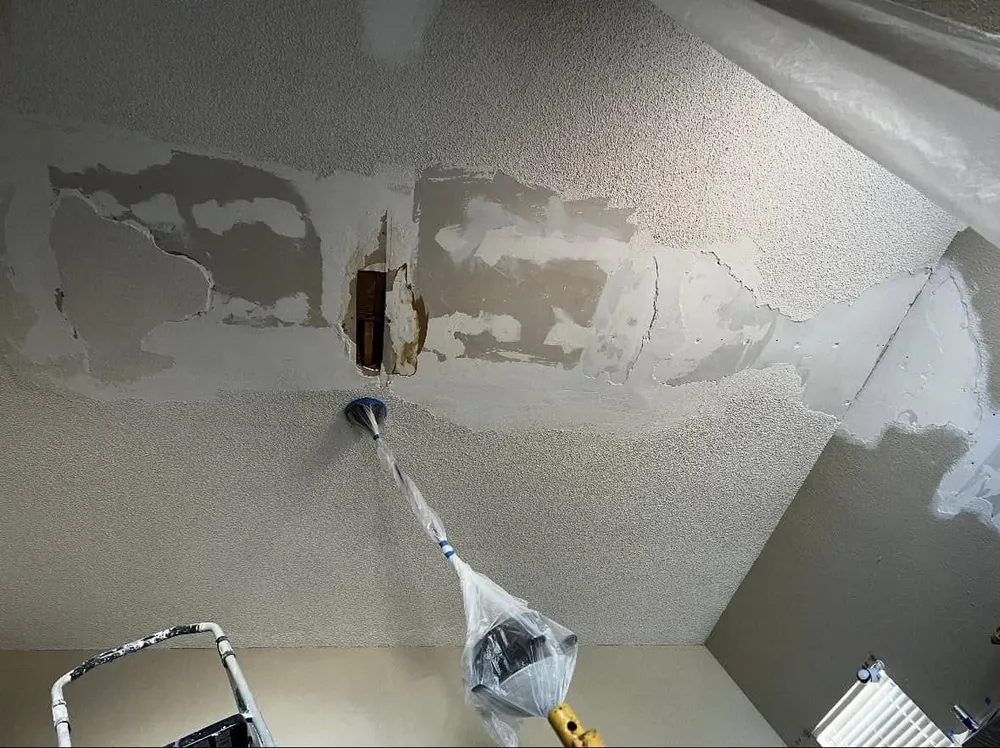 Ceiling with the popcorn texture partly scraped off