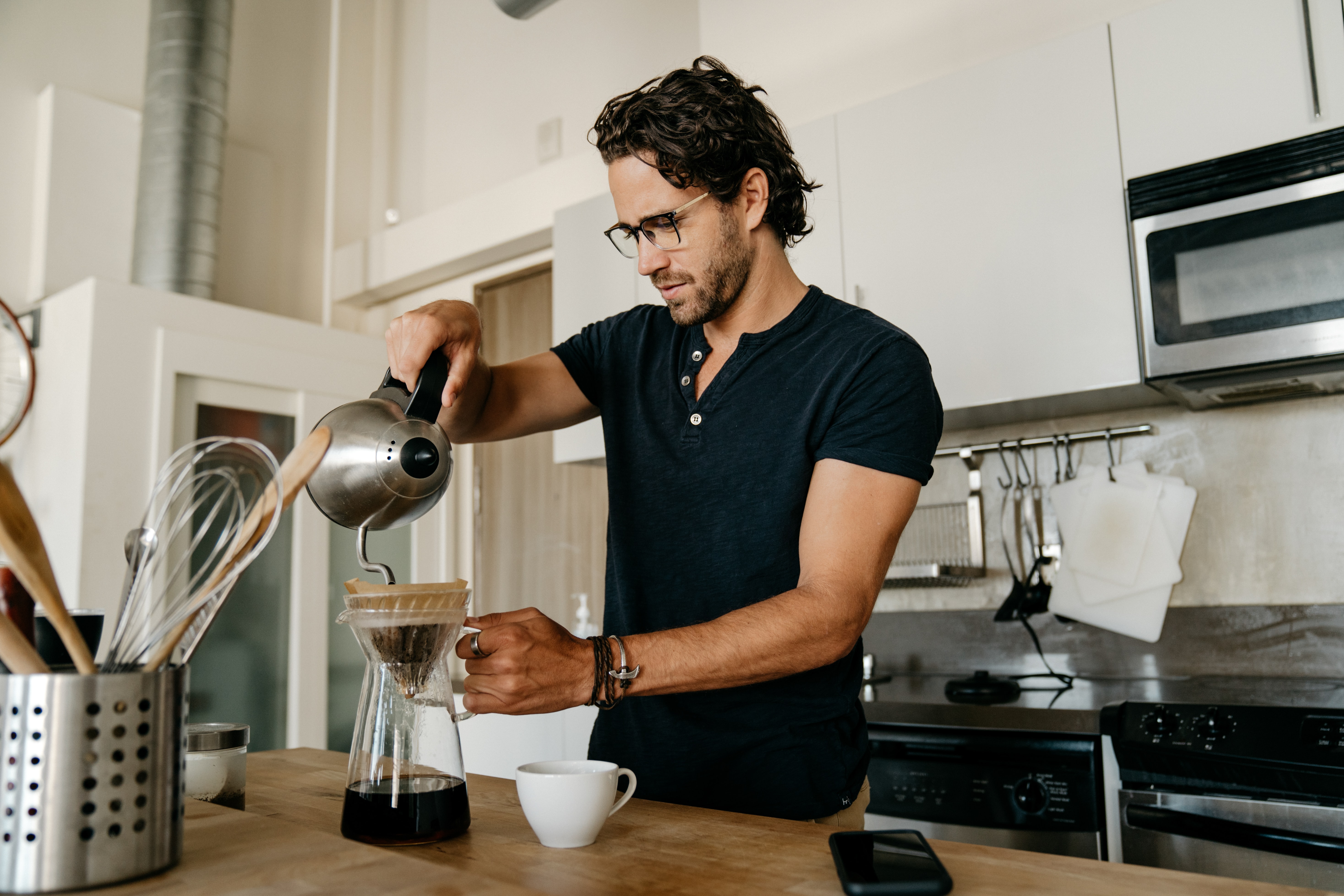 A man making coffee at home
