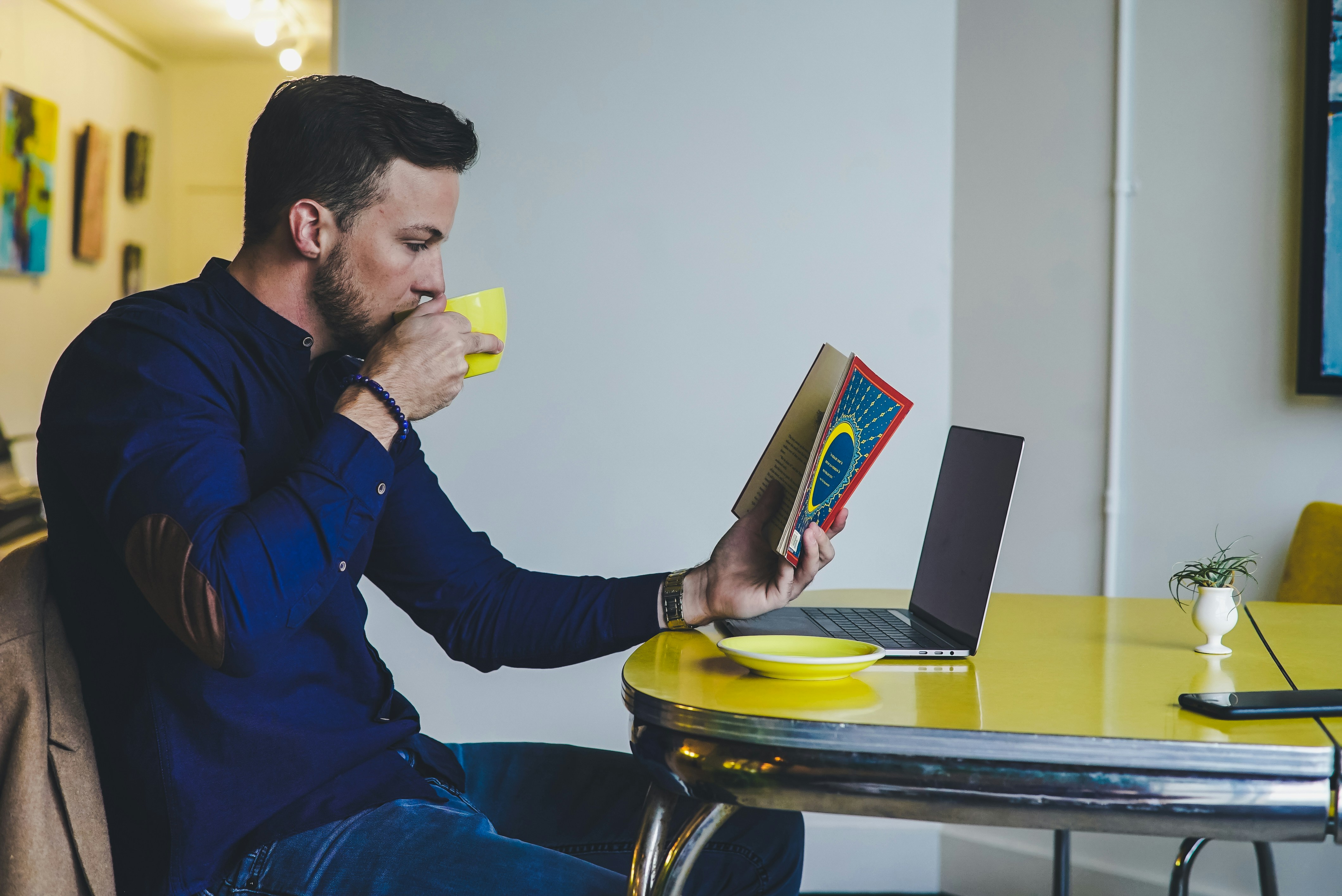 A man reading over coffee
