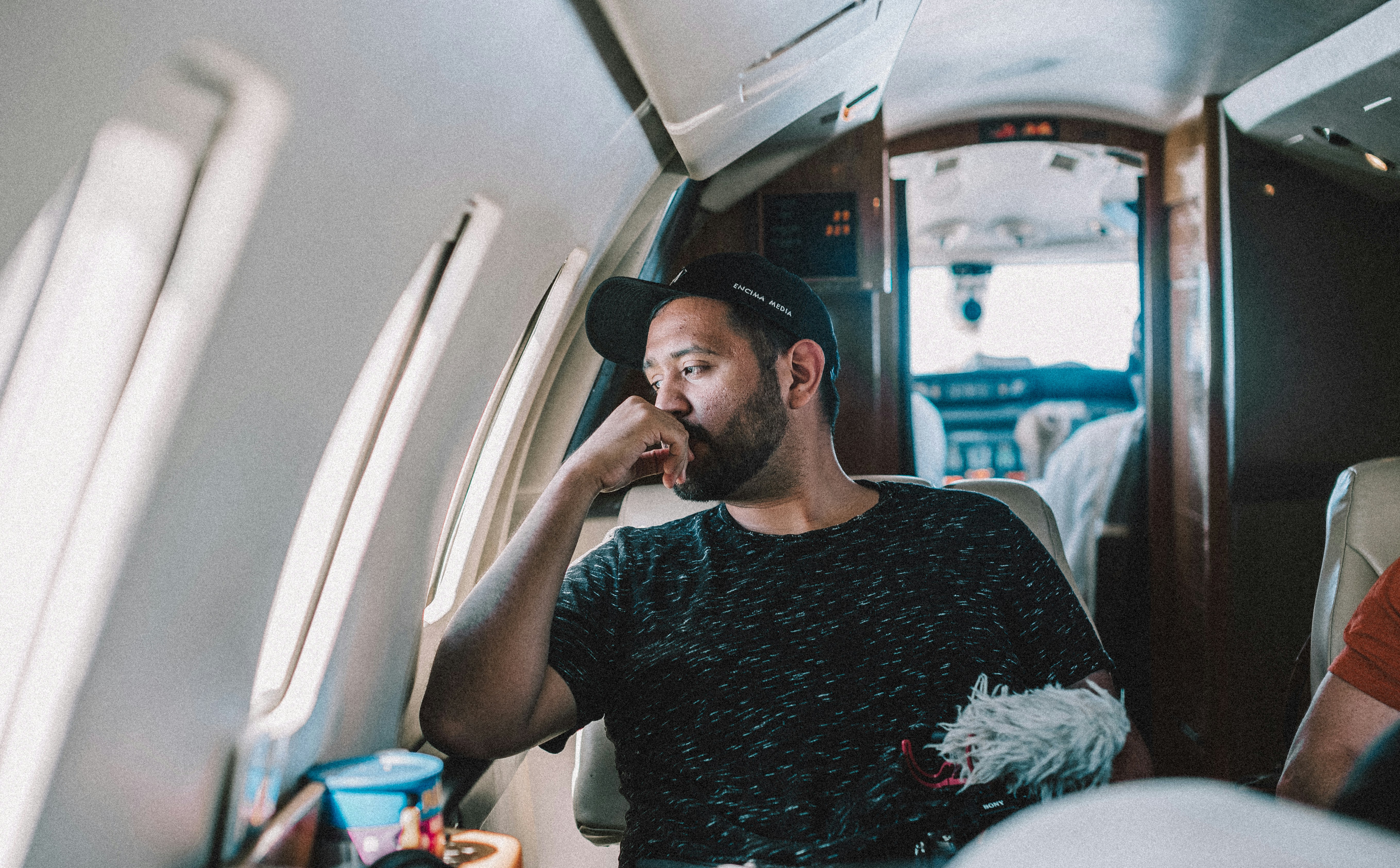 A man looking out of an airplane window