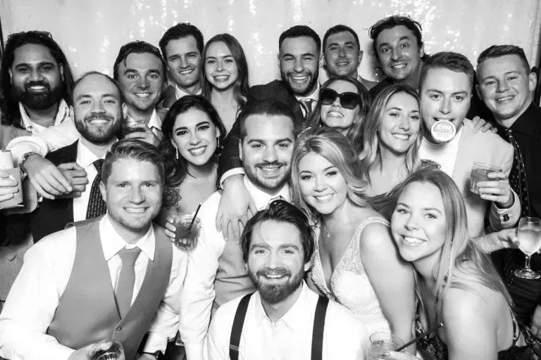 Large celebration group enjoying a Photo-N-Go photo booth together