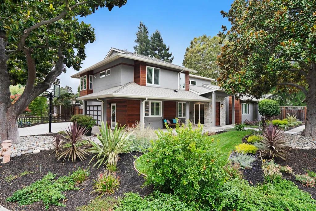 Front of a two-story Palo Alto home behind a planted garden
