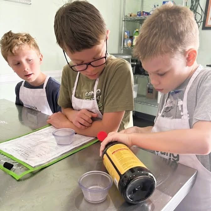 Kids reading a breakfast recipe
