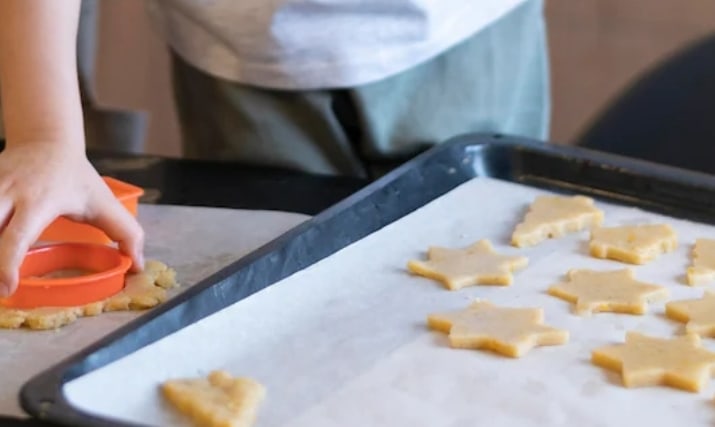 Kids cutting out cookies