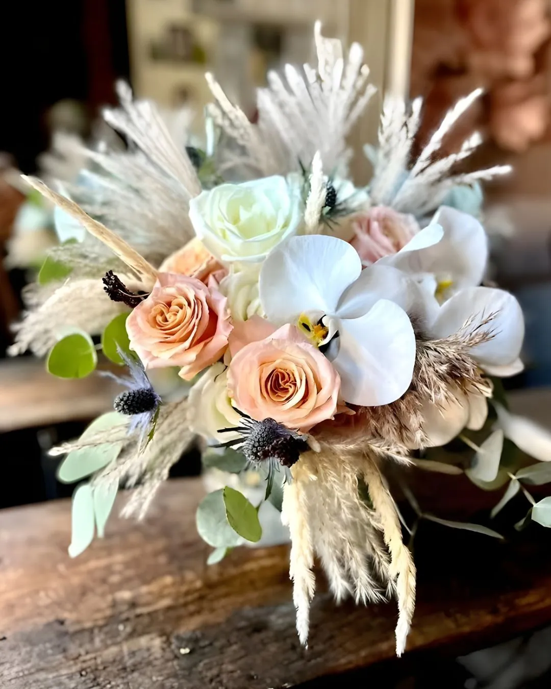 Boho bouquet with peach roses, orchids and pampas grass