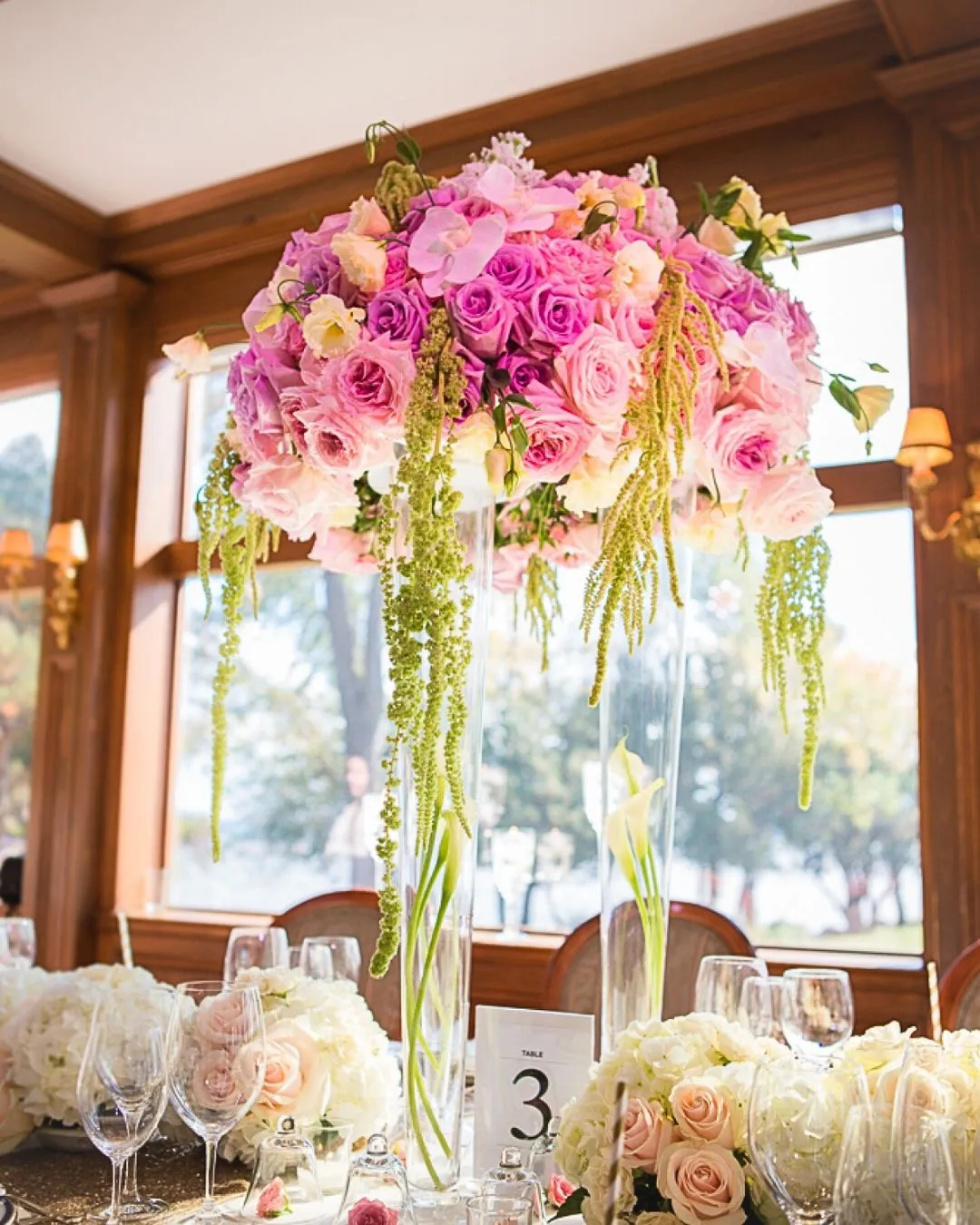 Tall pink rose centrepiece with hanging amaranthus