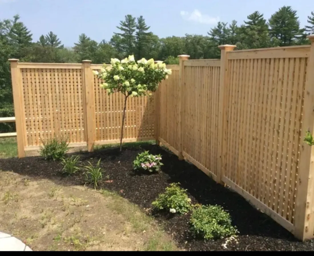 Cedar privacy fence with lattice panels by All Fenced In
