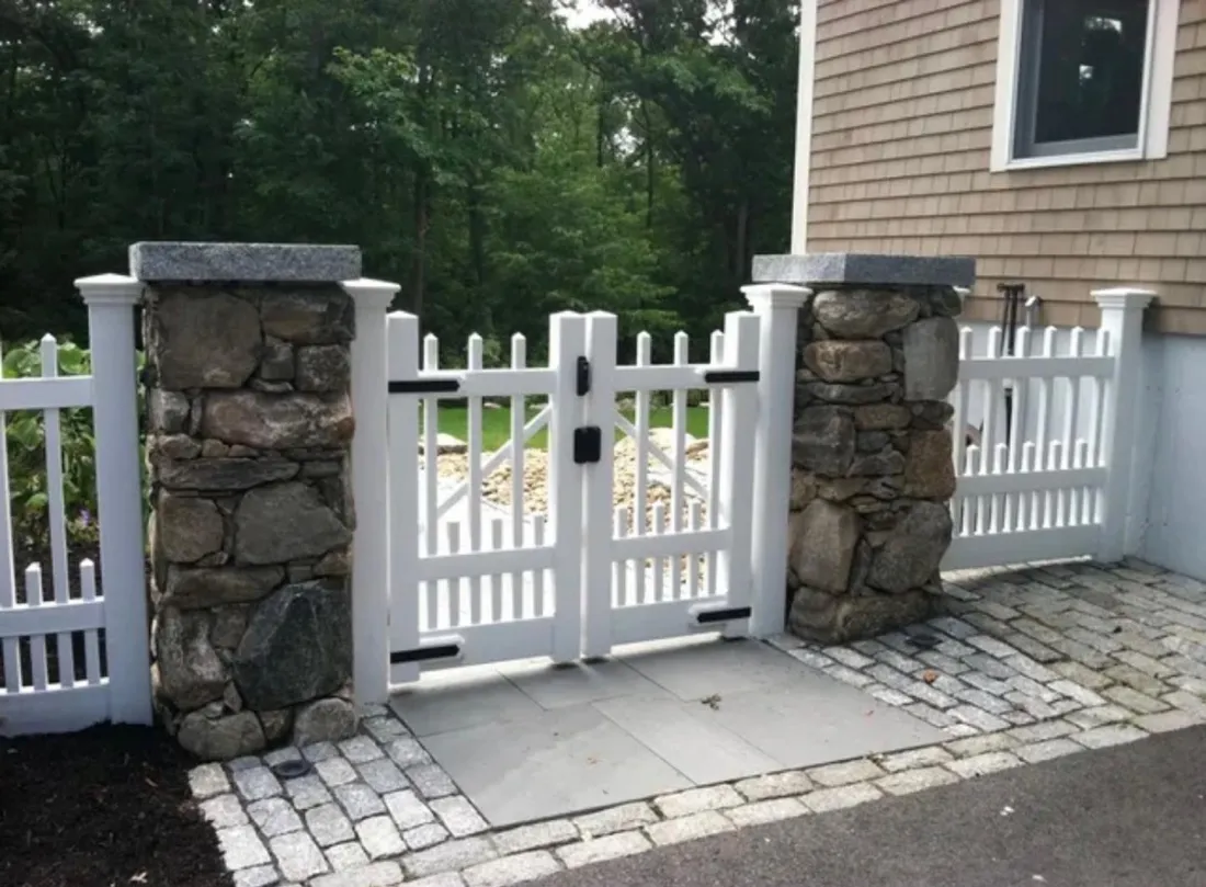 White vinyl gate with stone pillars by All Fenced In