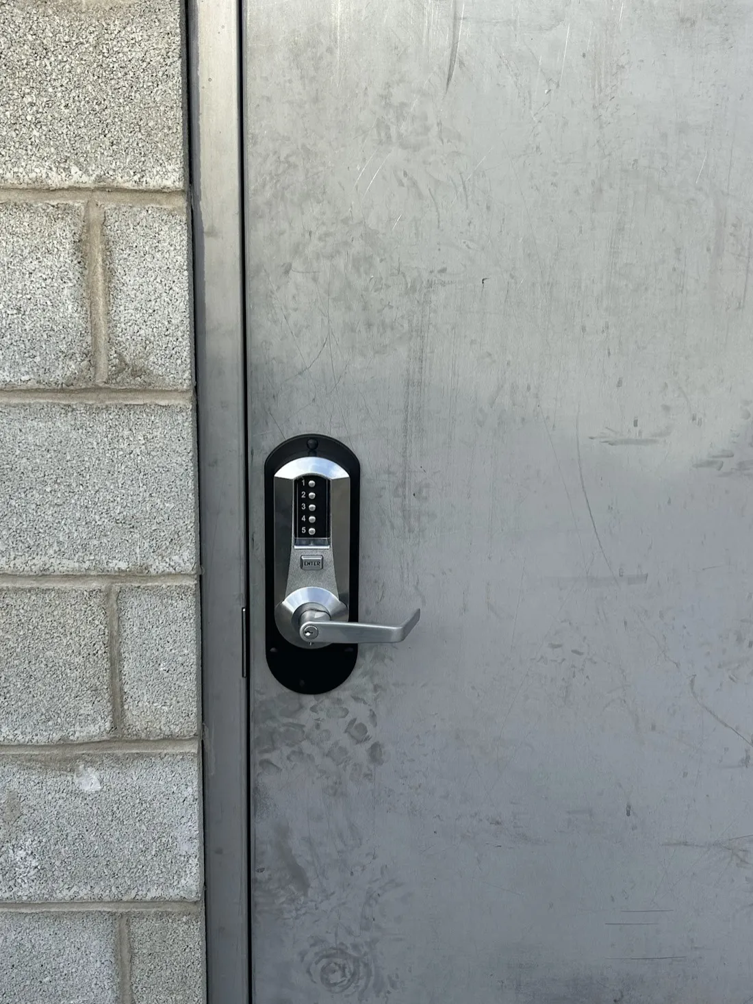 Keypad lever lock on a commercial steel door