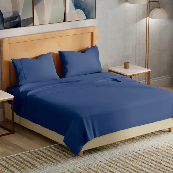 PureCare sleep accessories styled in a modern bedroom at Mattress Lux