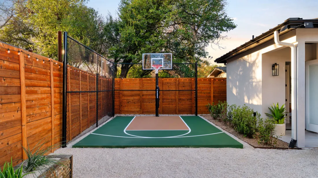 Compact half-court on a tight lot with cedar fencing