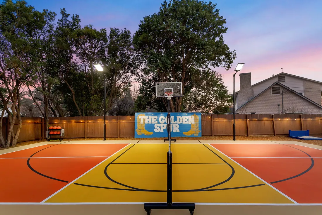 Half-court basketball with a custom color scheme and signage wall