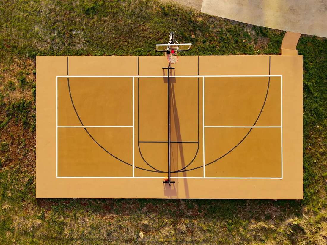 Full basketball court, aerial view at completion