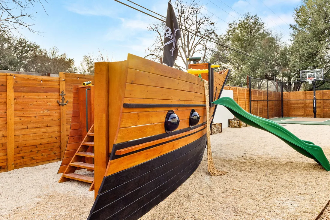 Pirate ship play structure with slide