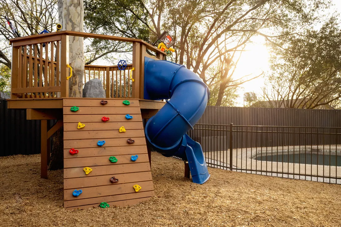 Custom climbing structure and slide