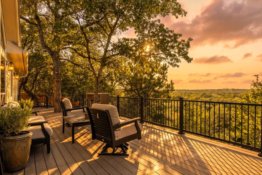 Deck with swivel lounge chairs looking over the Hill Country at sunset, Wimberley