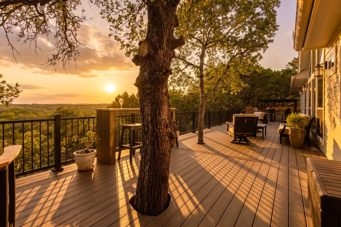 Composite deck built around a live oak at sunset, Wimberley