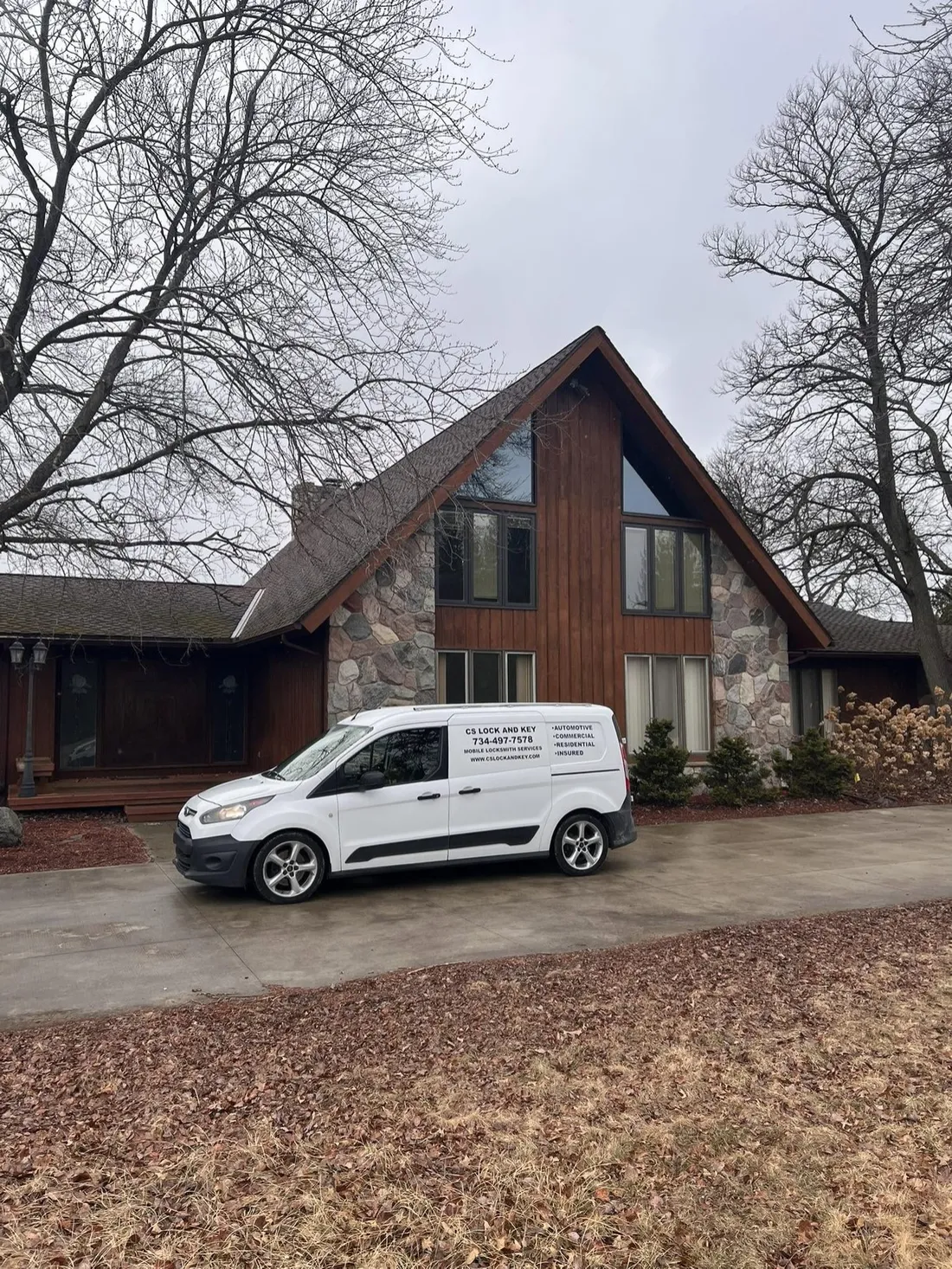 CS Lock and Key service van parked at a customer's home