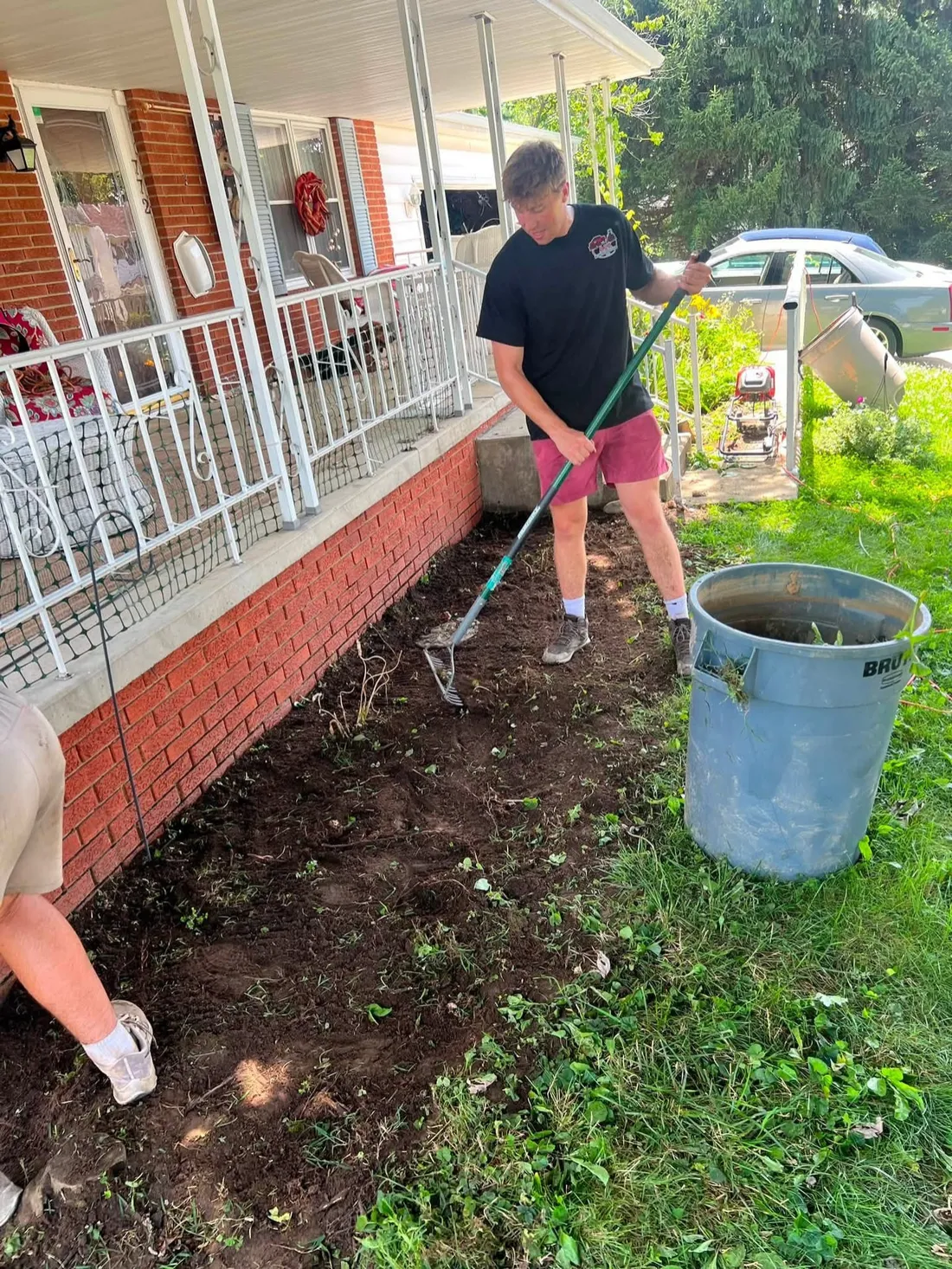 A planting bed cleared of weeds and overgrowth