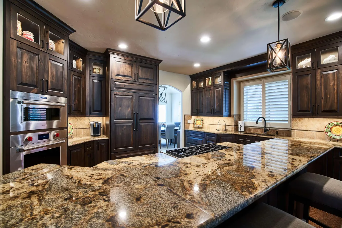 Brookhaven Lane Home main photo — Whole-home remodel with custom dark-stained cabinetry, granite counters, and continuous hardwood flooring.